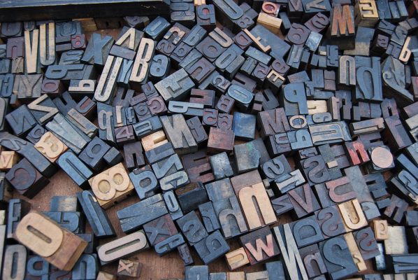 a random assortment of wooden letter stamps